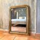 Antique gilded Louis-Philippe mirror, 19th century.