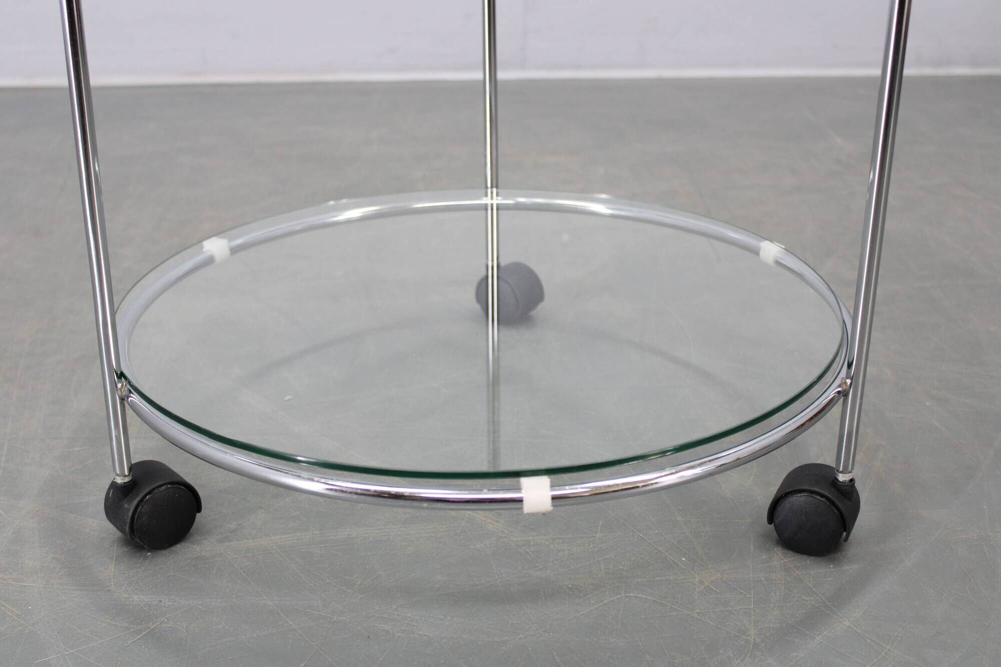 Mid-century round serving table, chrome and glass, Italy, 1980s