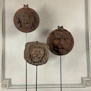 Three cast-iron and terracotta façade decoration lions, around 1880.