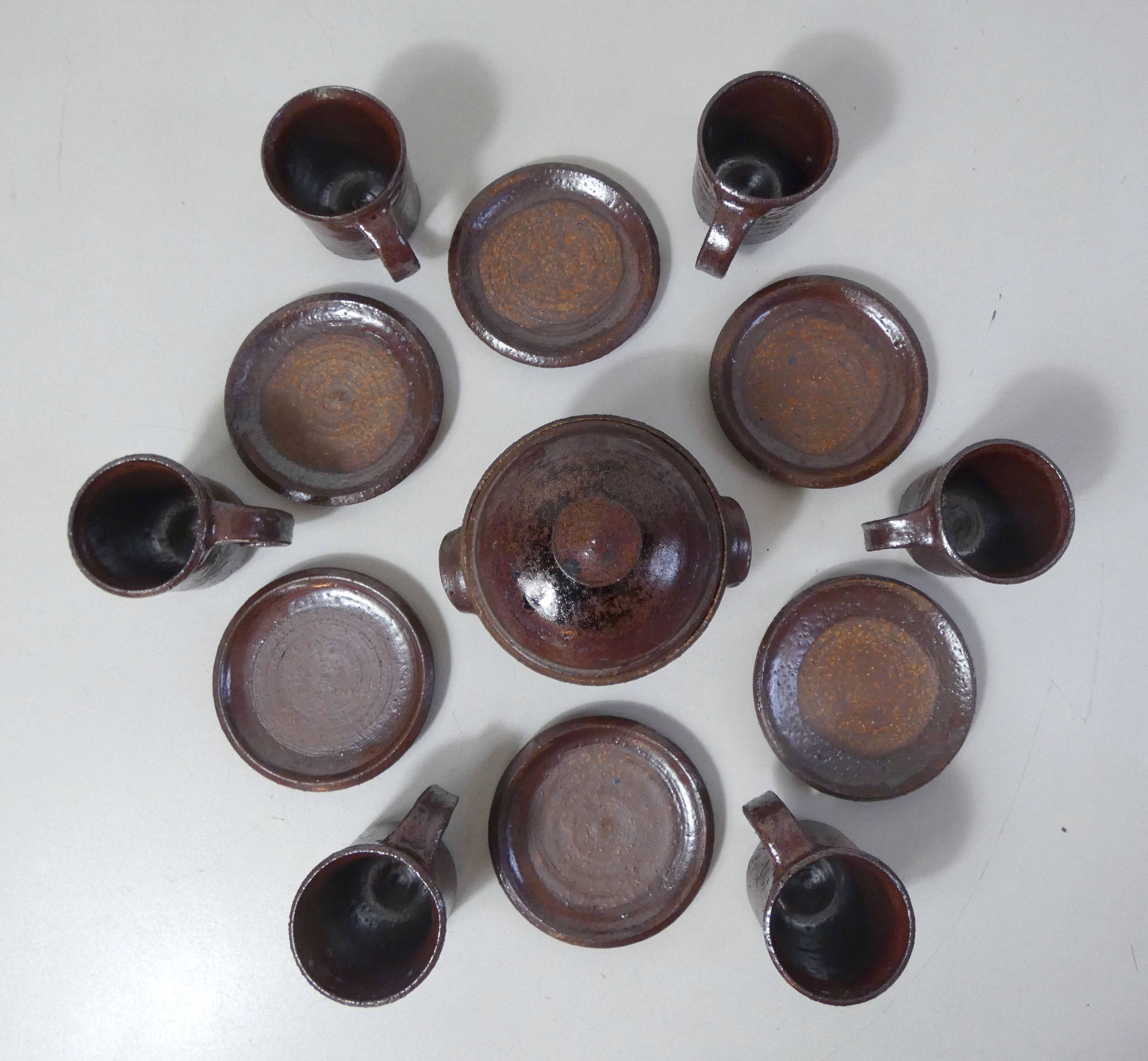 coffee service in iridescent stoneware cups and vintage sugar bowl