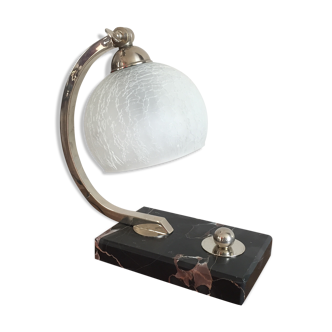 Art-deco lamp on marble with its original metal frame and the globe is cracked glass.
