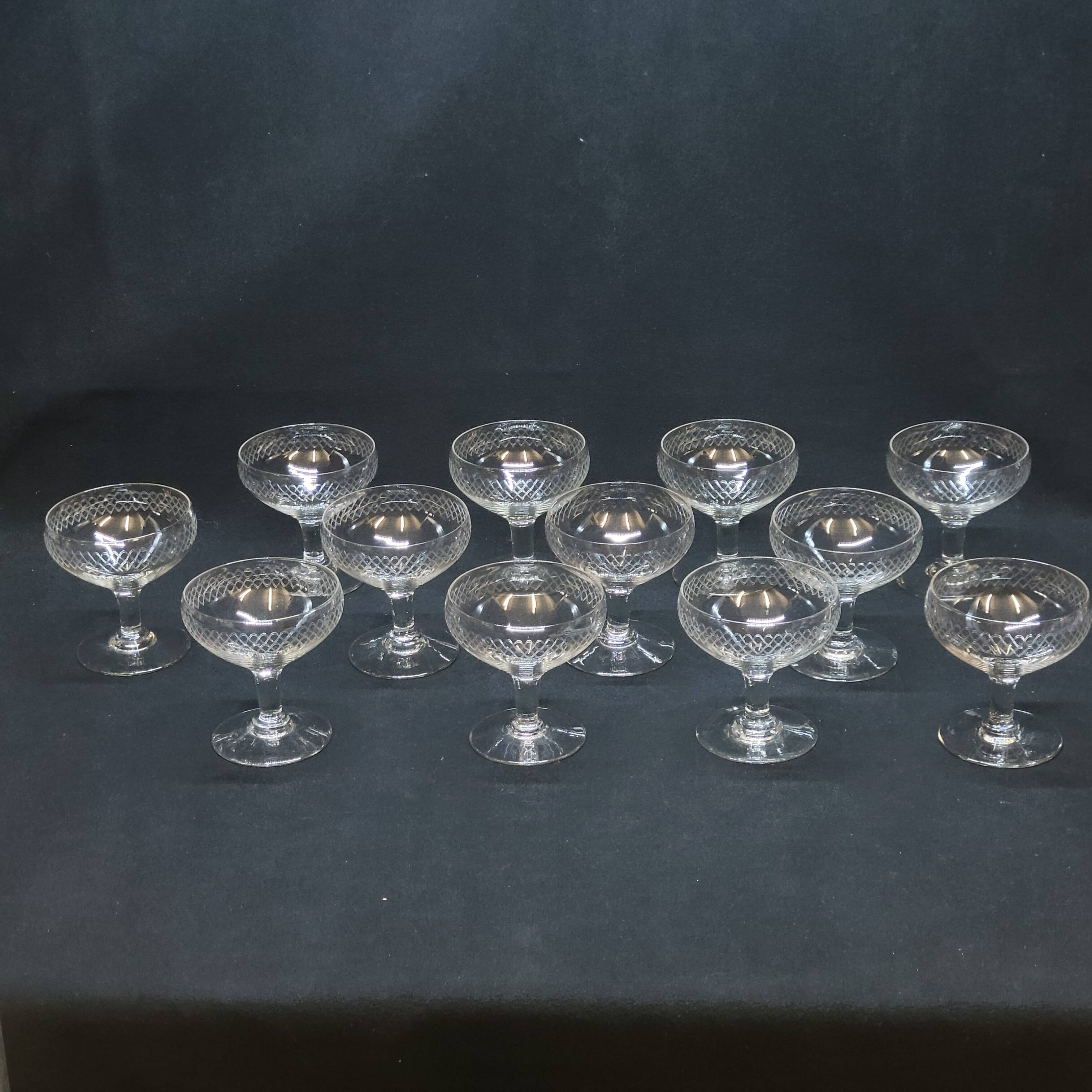 12 old champagne glasses in blown and engraved glass
