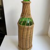 bottle surrounded by rattan 70s