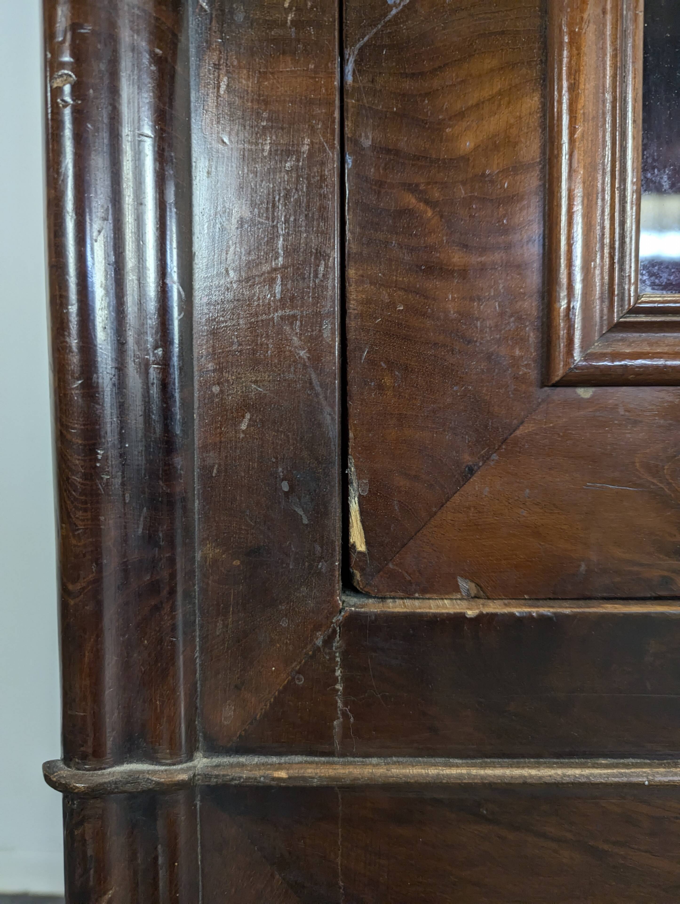 Louis Philippe period glass cabinet in flamed mahogany