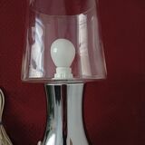 Table lamp, chrome glass stand and transparent glass globe.
