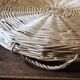Large round wicker tray with two handles, vintage weaving.