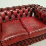 Three-seater red leather chesterfield sofa