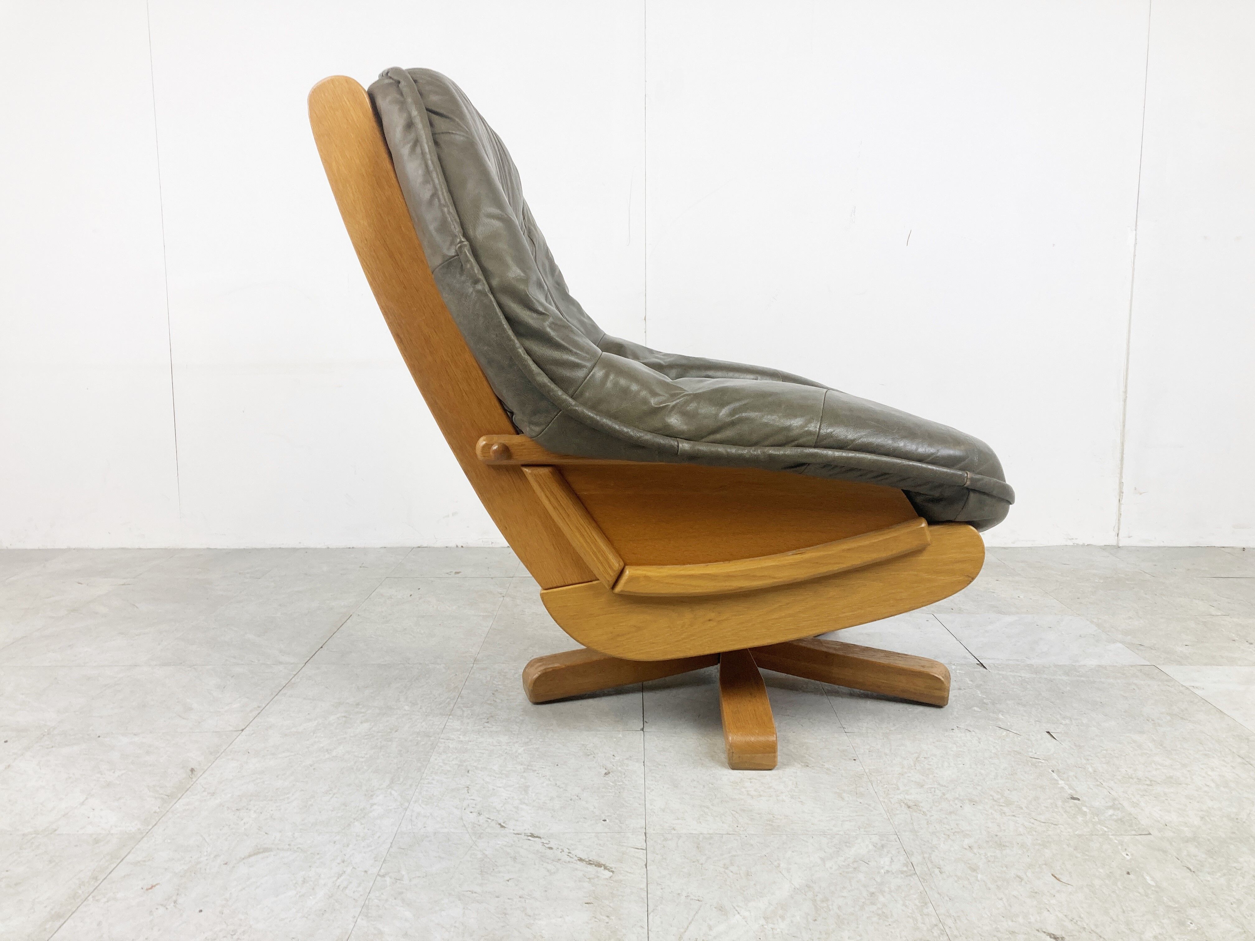 Brutalist oak and leather swivel chair, 1970s