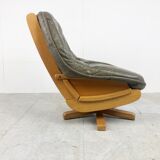 Brutalist oak and leather swivel chair, 1970s