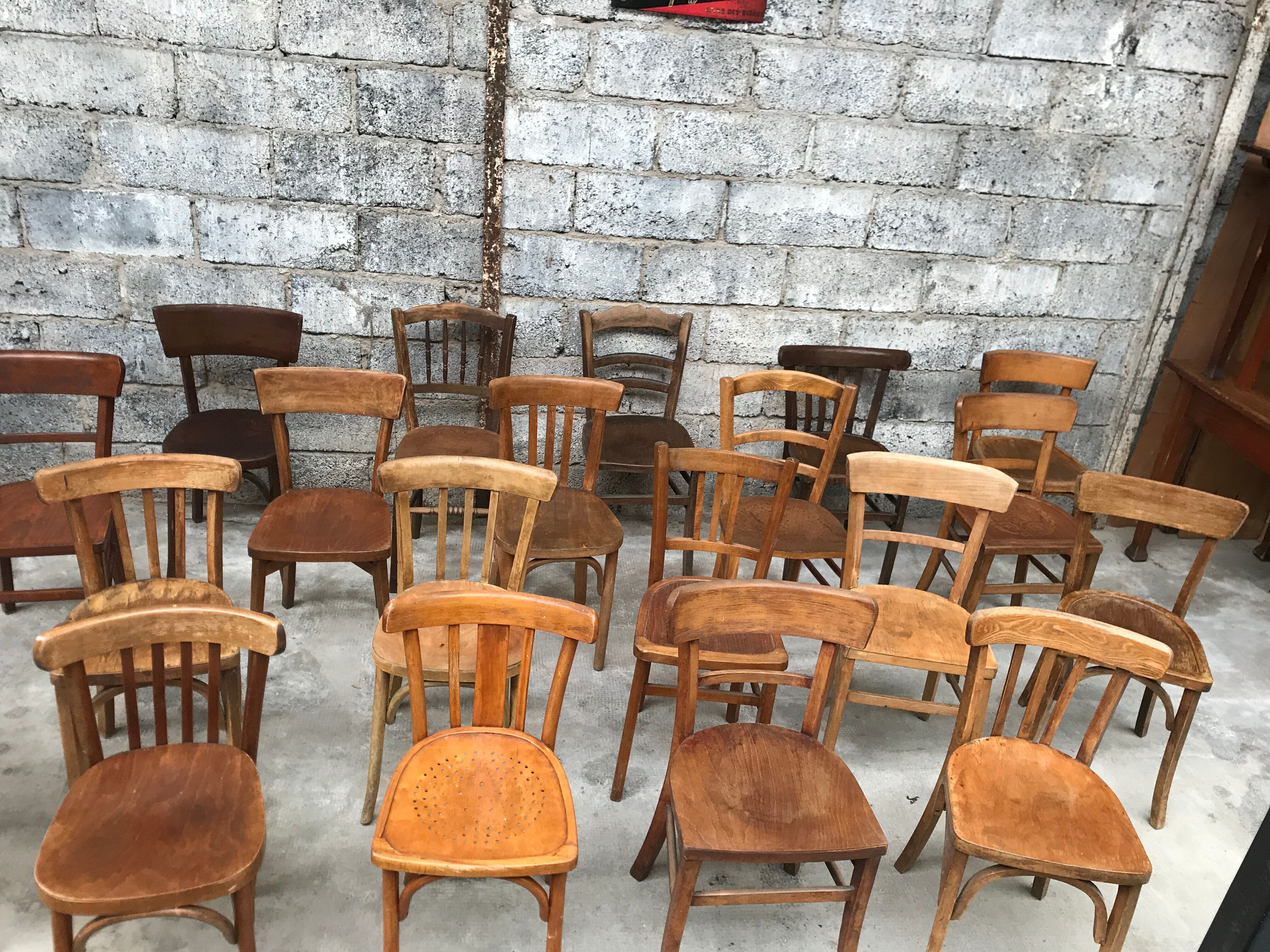 Set of 15 mismatched curved wood bistro chairs
