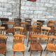 Set of 15 mismatched curved wood bistro chairs