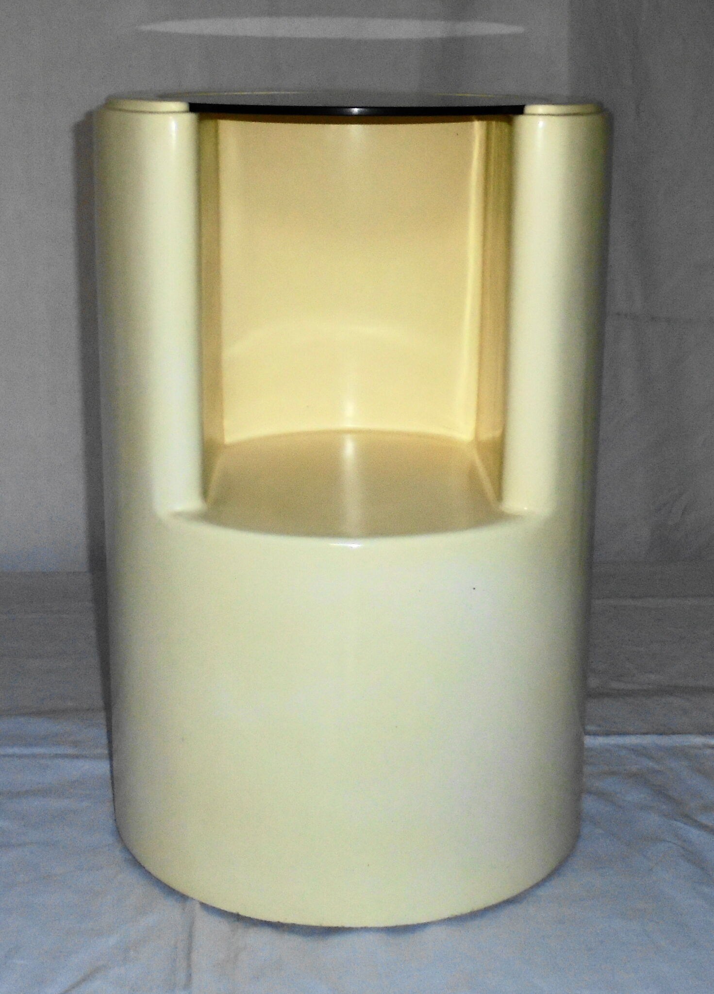 Cylindrical fiberglass bedside table from the 60s