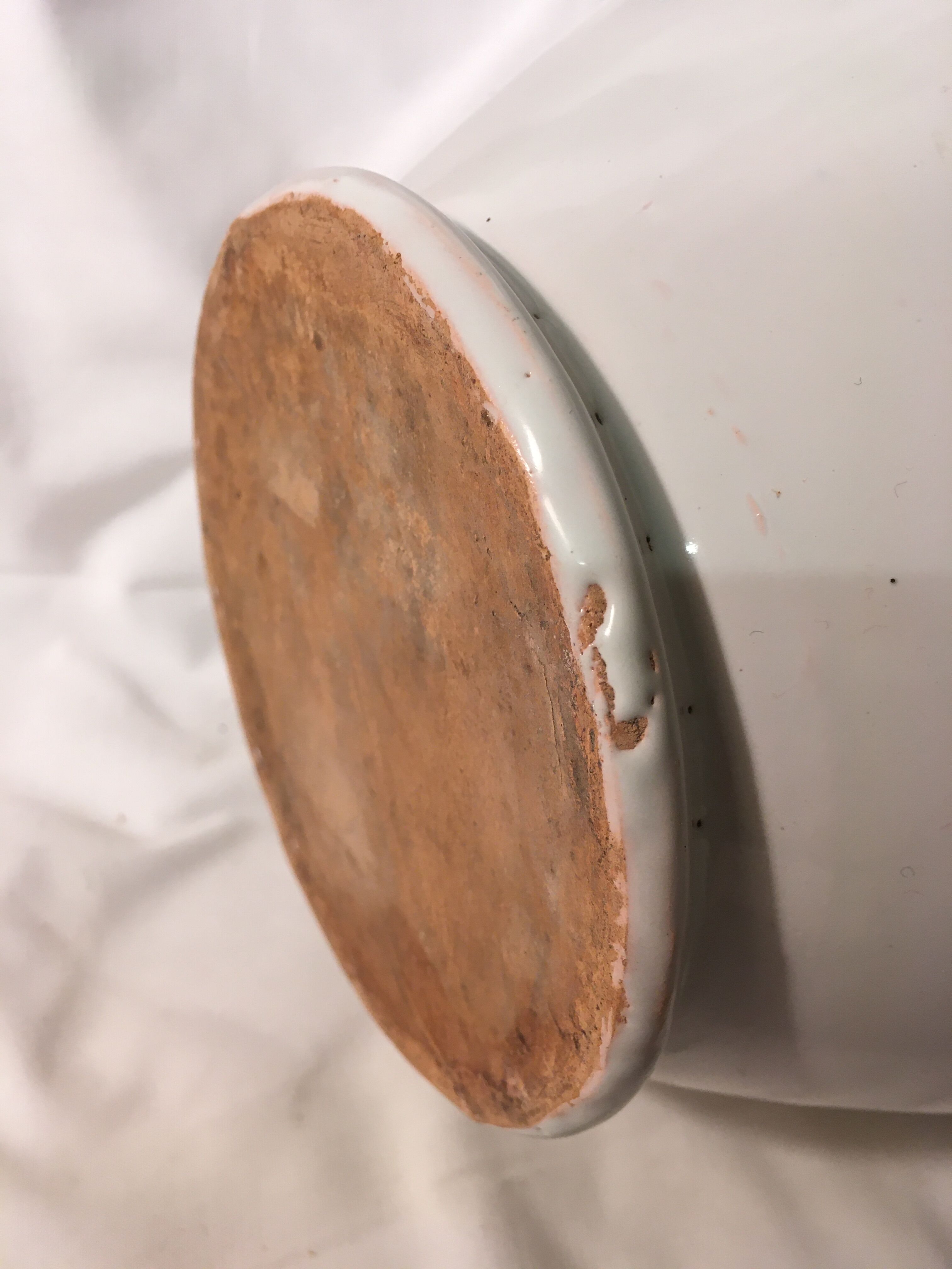 Old chevrette / pitcher in white earthenware