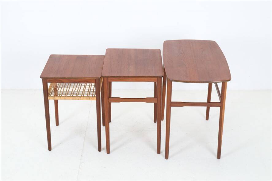 Rare set of three teak nesting tables with cane magazine rack / side tables / mid-century Danish modern design / 1950s / 1960s