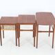Rare set of three teak nesting tables with cane magazine rack / side tables / mid-century Danish modern design / 1950s / 1960s