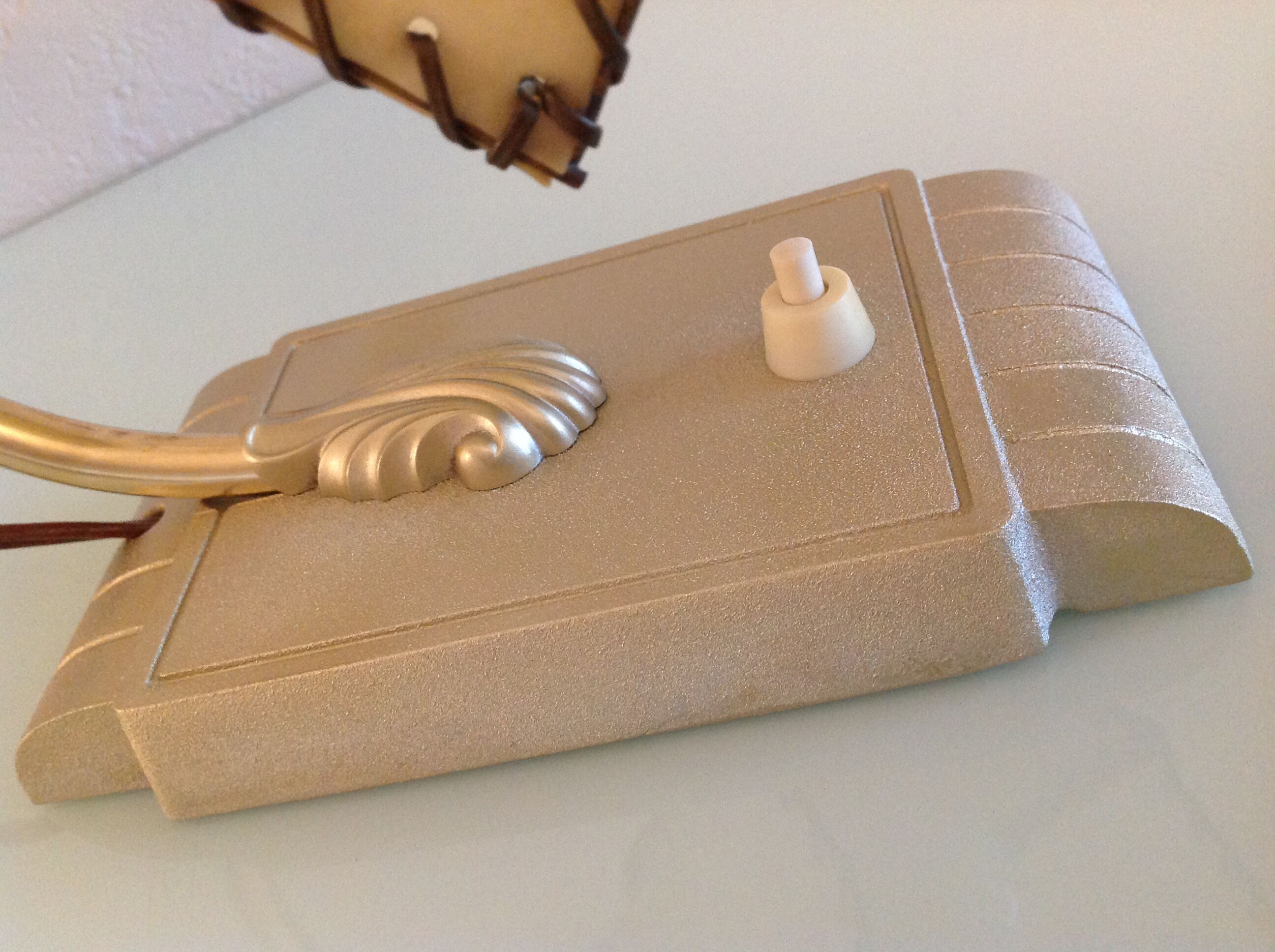 Brass bedside lamp and beige lampshade art deco style