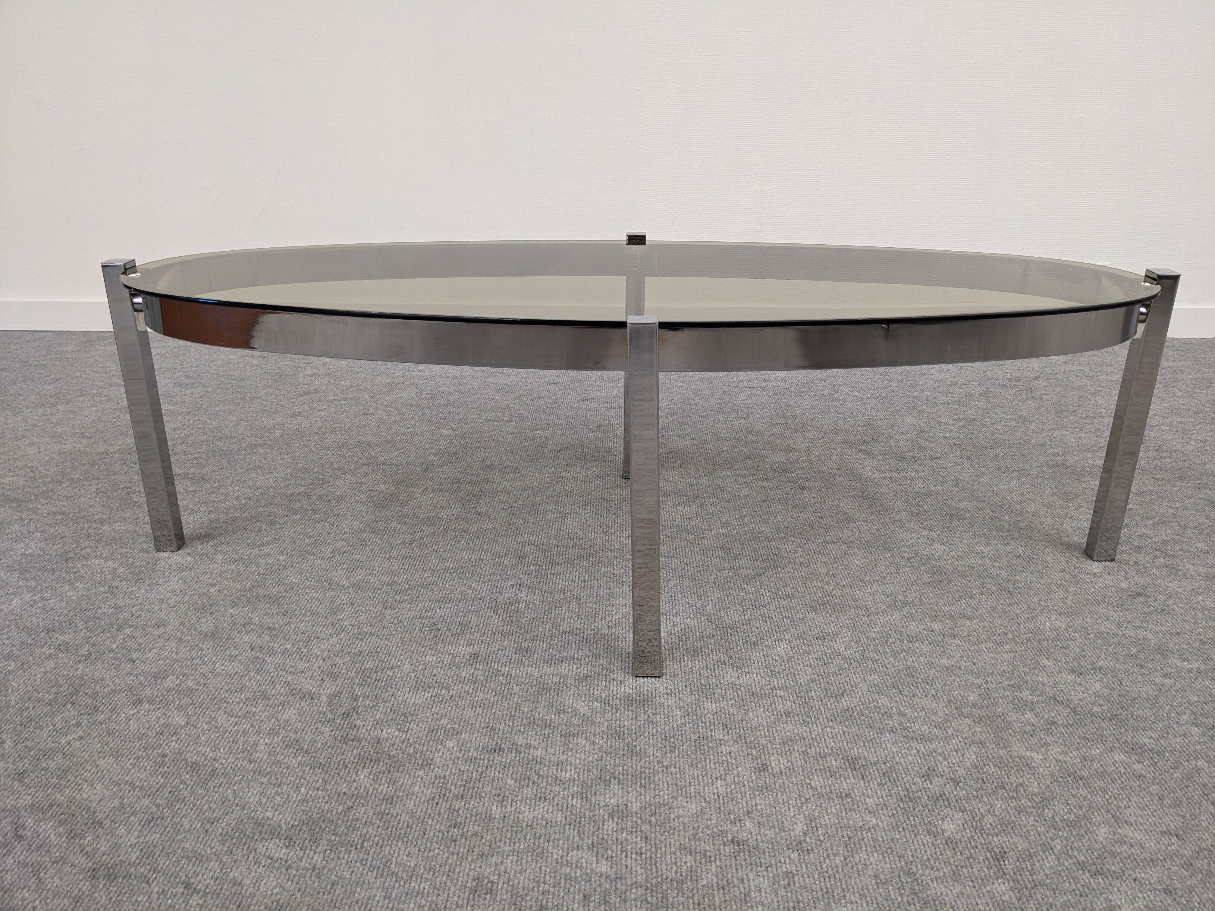 Oval smoked glass coffee table from the 60s/70s