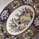 Ceramic dish decorated with peacock folk art Asian motif