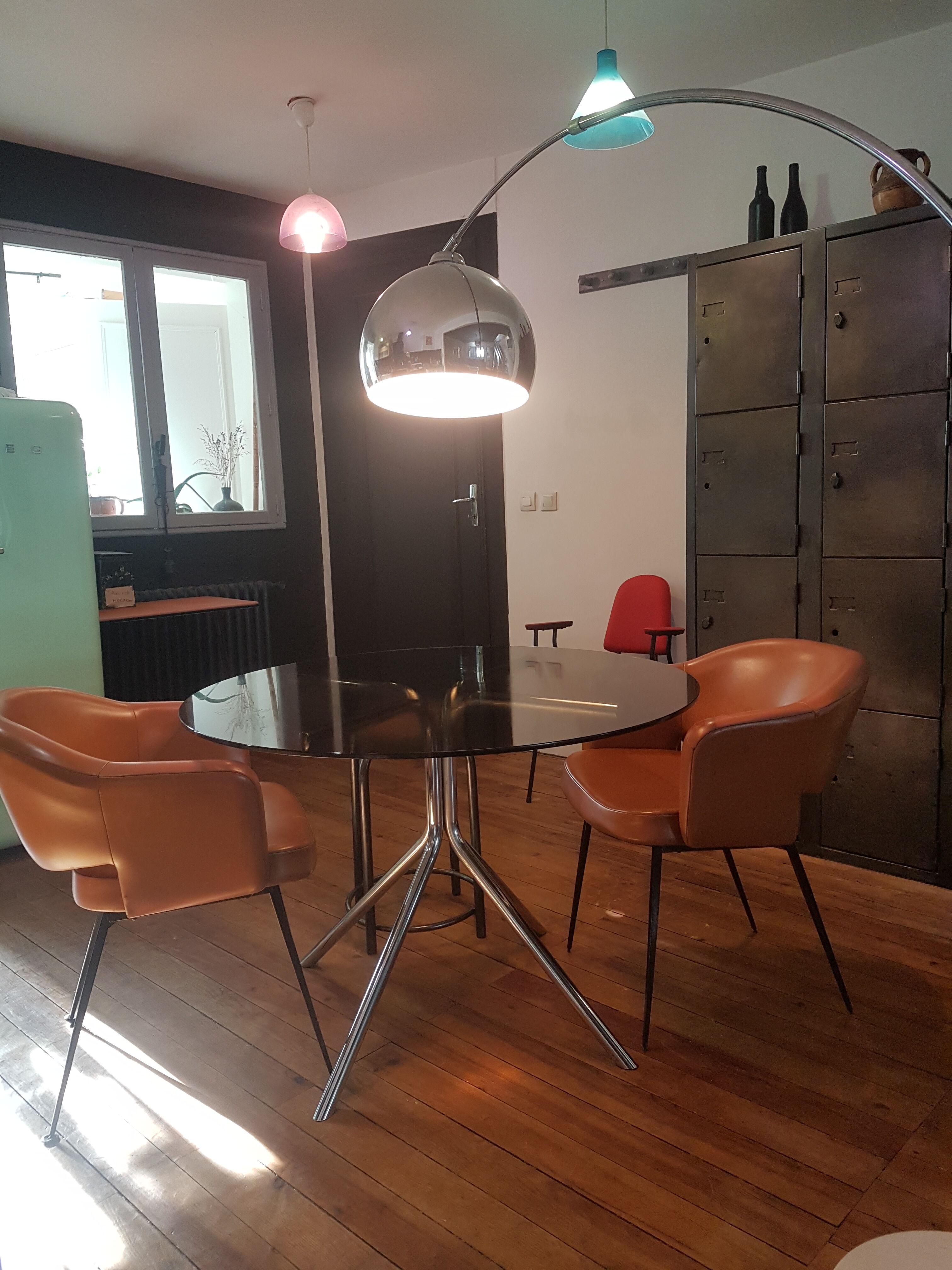 Smoked glass round table and chrome foot