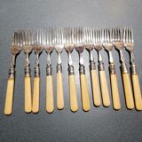 Old silver fish forks with bone handles