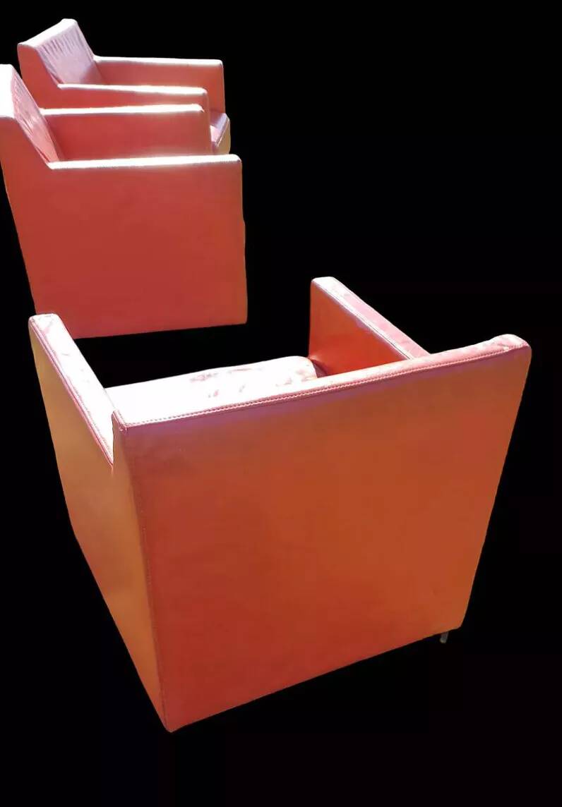 Pair of orange leather club chairs 1980