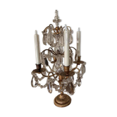 Candle holder or candelabrum with four arms of light.