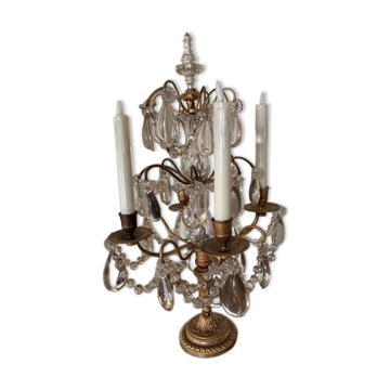 Candle holder or candelabrum with four arms of light.