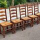 4 or 5 solid wood chairs with light oak straw and high backs