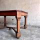 French dining table in Neo-Renaissance style with cross legs.