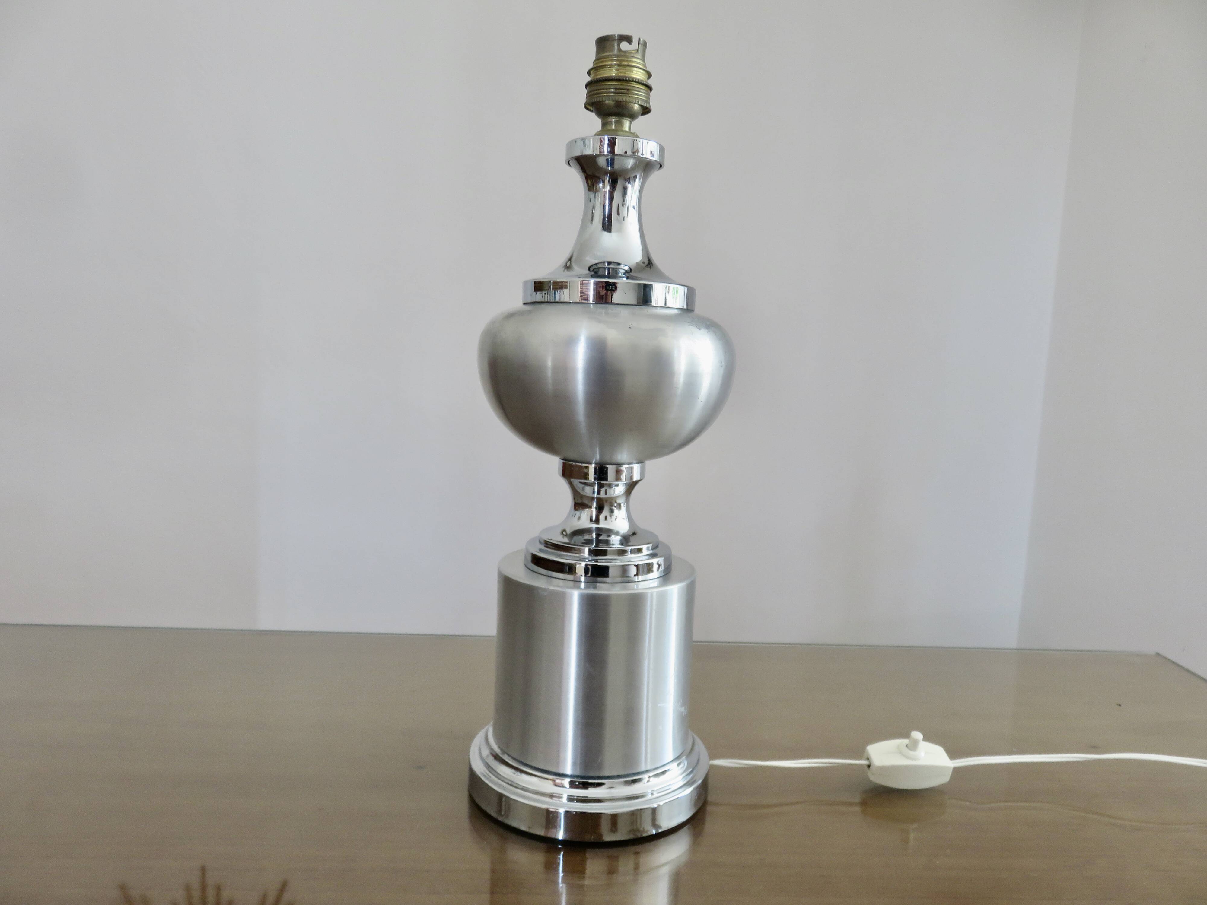 Brushed aluminum and chrome lamp typical of the 70s