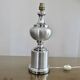 Brushed aluminum and chrome lamp typical of the 70s