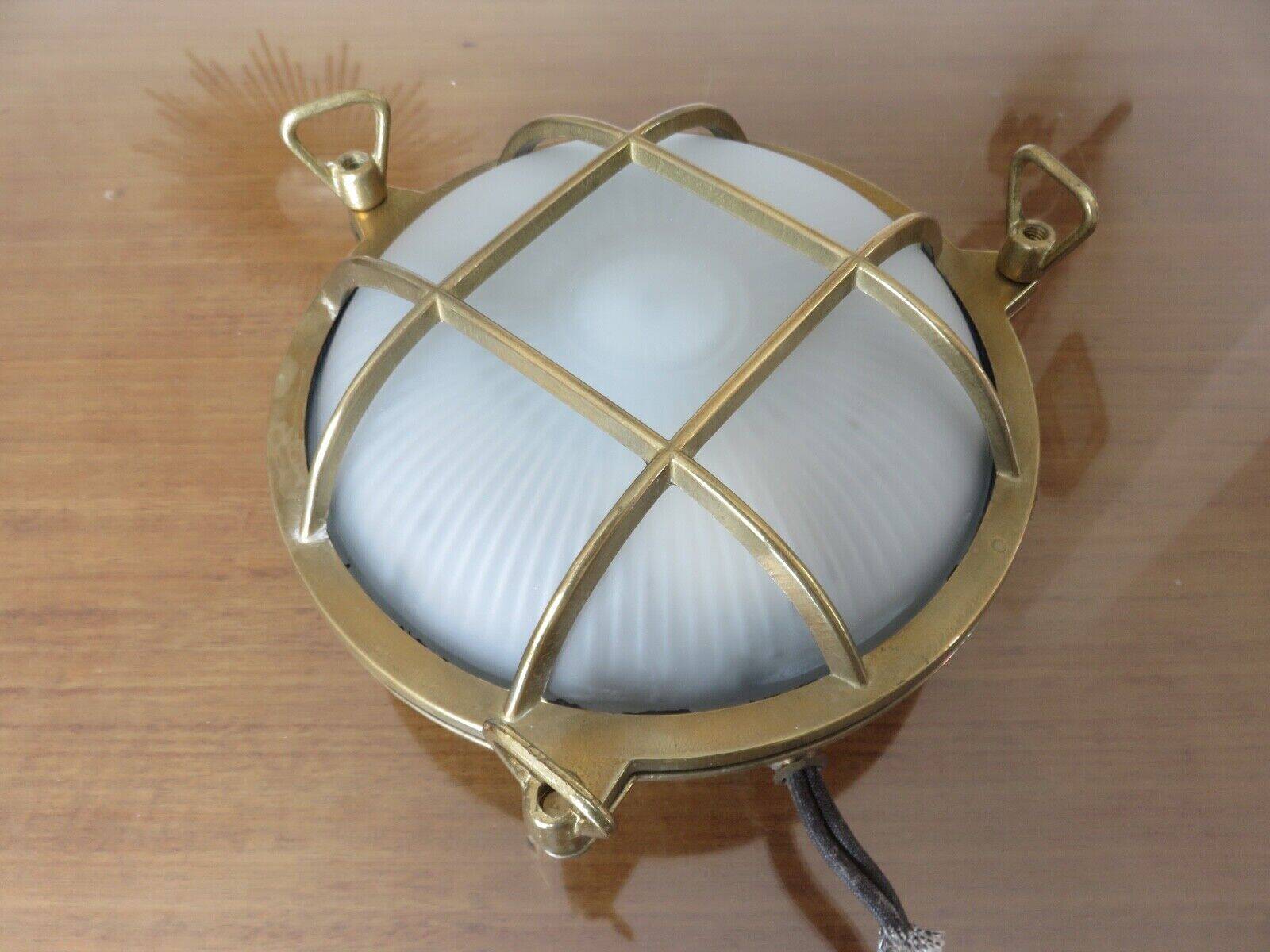 Brass porthole wall lamp