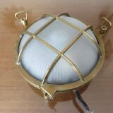 Brass porthole wall lamp