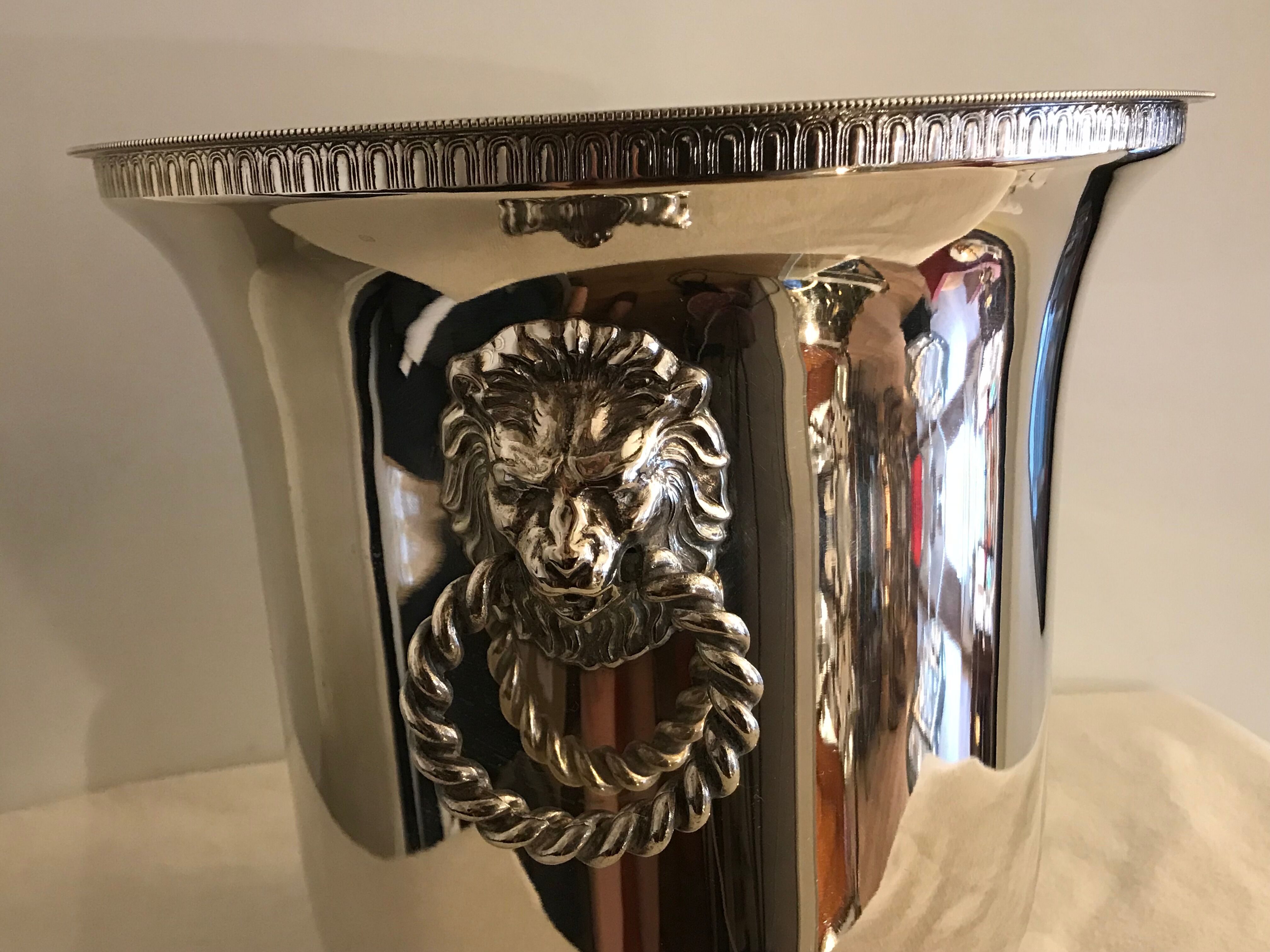 Ancient champagne bucket in silver metal with lion heads