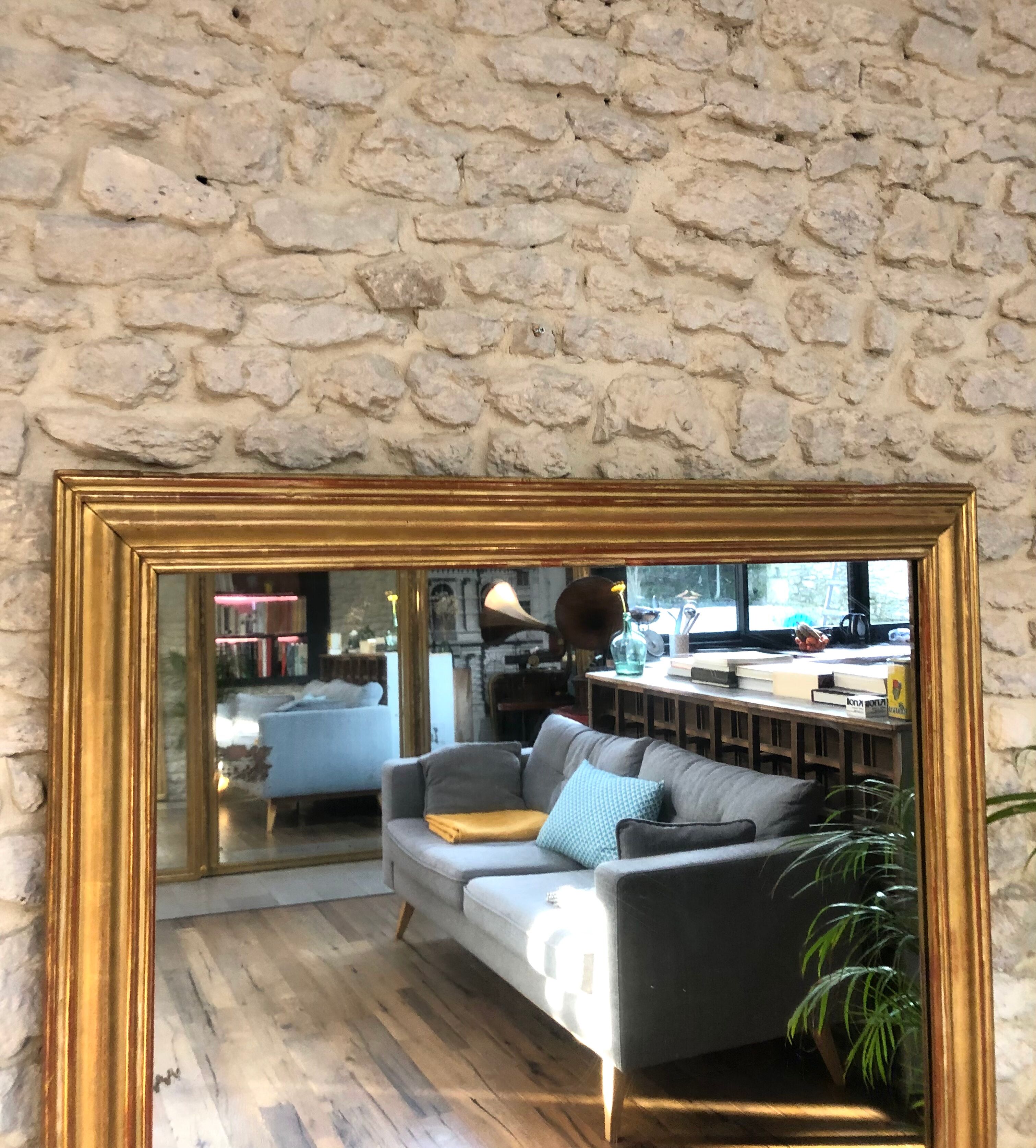 Mirror period 19th gilded with gold leaf 158.5cm / 113cm mercury ice pricked, parquet on the back.