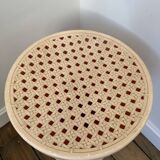 Tam Tam Stamp stool Made in France with a woven rattan-style seat.