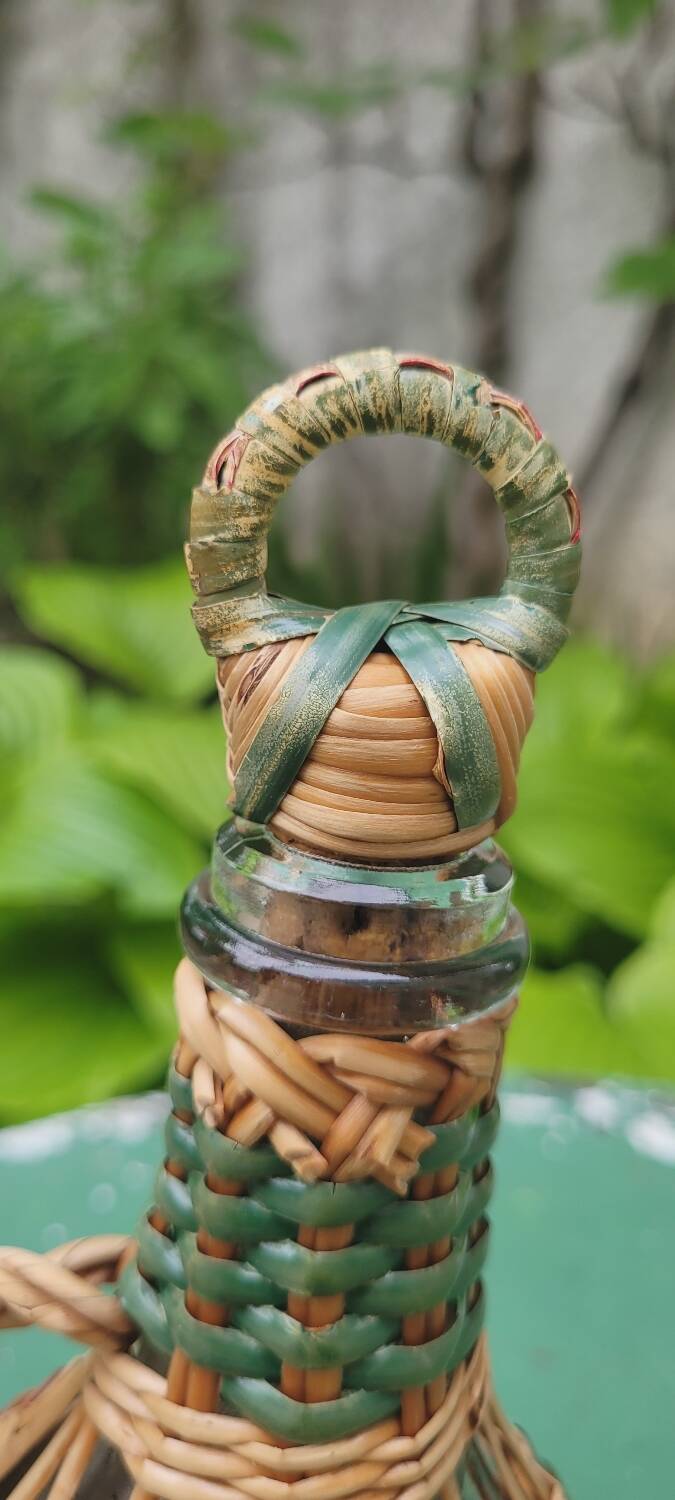 Glass and rattan carafe