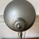 Industrial metal workshop lamp with a gooseneck.