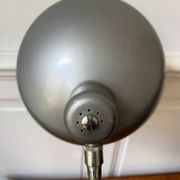 Industrial metal workshop lamp with a gooseneck.