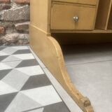 On a piece of furniture with sorting lockers and drawers