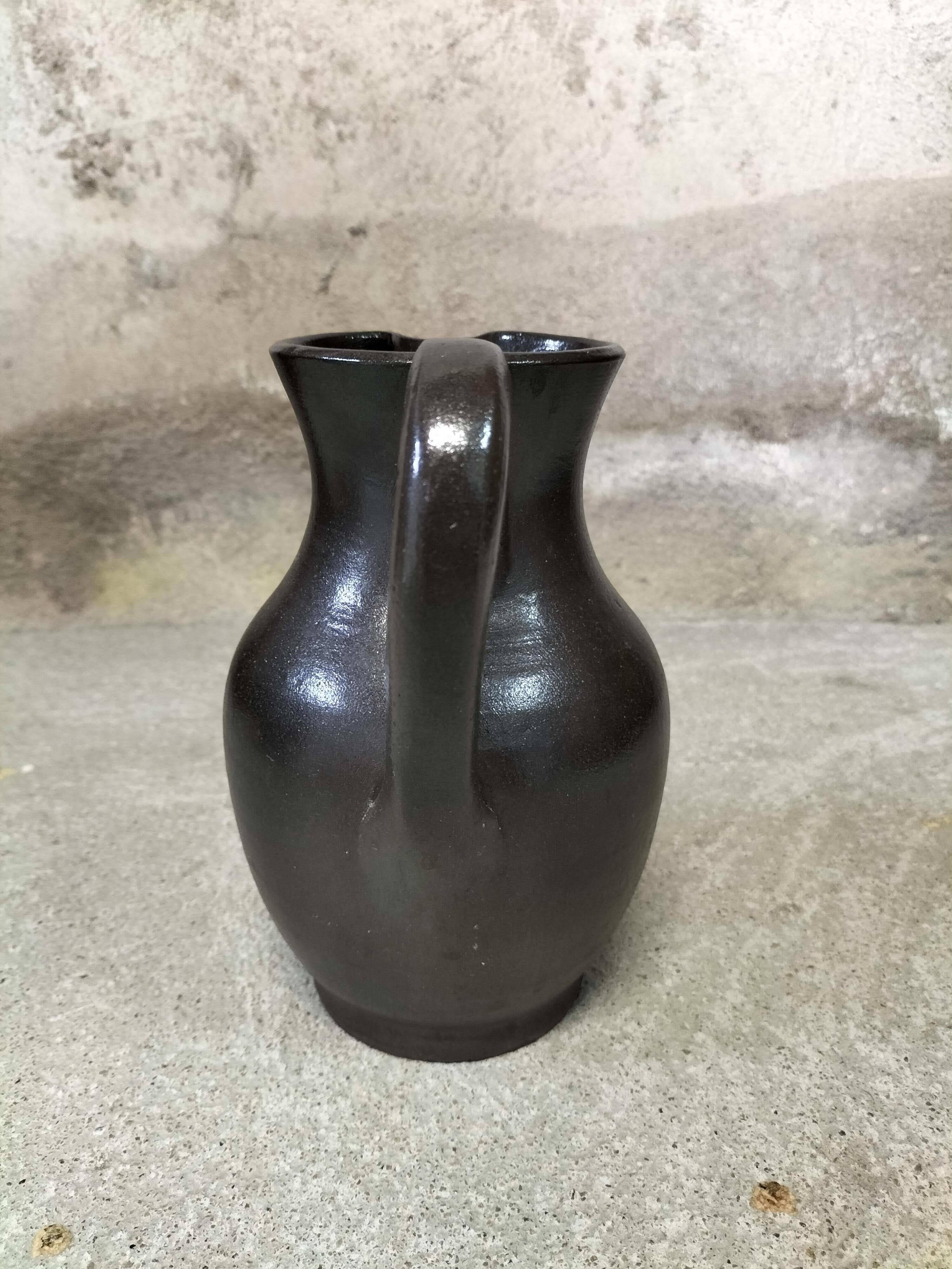 Ceramic pitcher signed Jean Dubost