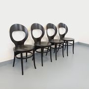 Set of 4 vintage Mouette chairs by Baumann in black wood from the 1960s.