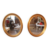 Pair of golden oval mirrors