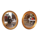 Pair of golden oval mirrors