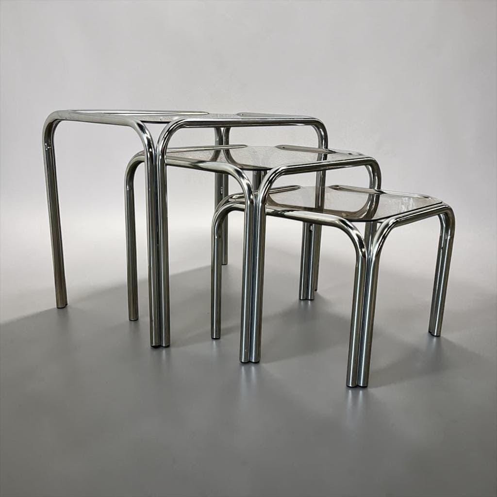 Set of 3 vintage chrome nesting tables with smoked glass.