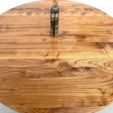 Modernist round table in solid elm, crossed legs.