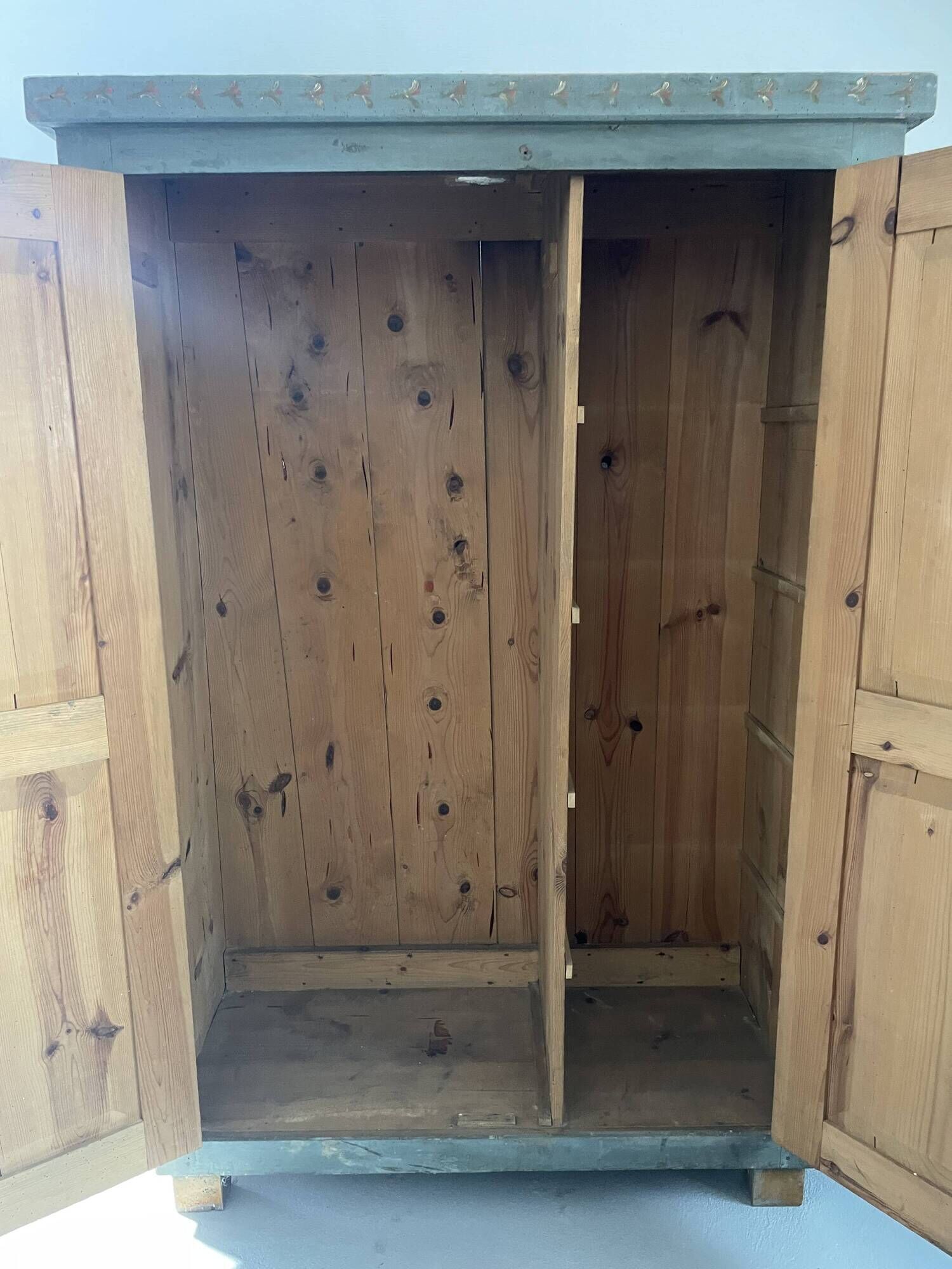 Wedding wardrobe painted in folk art style.