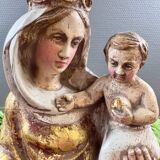 Statue of the Virgin holding the Child Jesus in polychrome terracotta.