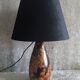 Carved wooden lamp with floral motif