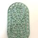 Old oval trivet in green enameled cast iron